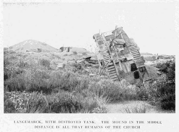 LANGEMARCK, WITH DESTROYED TANK. THE MOUND IN THE MIDDLE
DISTANCE IS ALL THAT REMAINS OF THE CHURCH